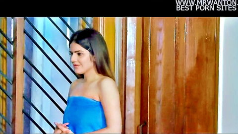 Sexy Indian babe in tight blue tube top teasing with deep cleavage by wooden door