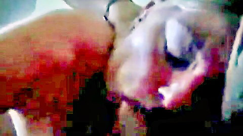 Blurry close-up of flushed woman's open mouth and tongue during messy oral sex