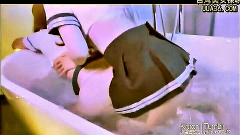 Asian schoolgirl lifts skirt flashing wet ass and pussy in bathtub