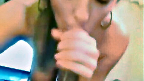 Busty babe with hoop earrings slurping thick black cock in intense closeup blowjob.