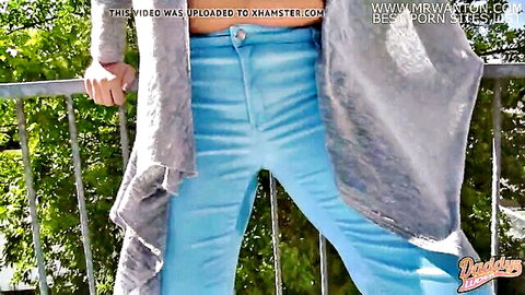 Woman in blue jeans wetting pants on balcony, daddy's slut solo fetish