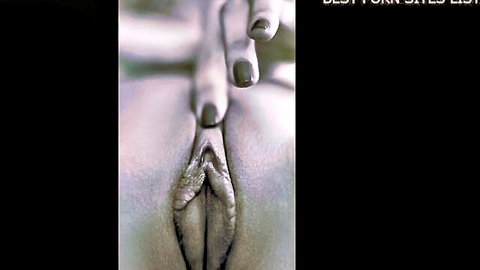 Black and white close-up of spread shaved pussy and curvy ass with manicured hand