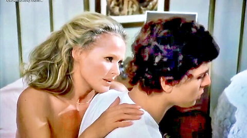 Ursula Andress topless blonde embracing man in nude scene
