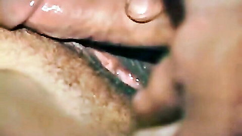 Close-up of hairy wet pussy being fingered