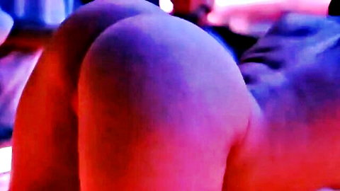 Alexis Texas big round ass in neon-lit pose