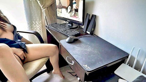 Young Asian babe exposes big tits and spreads legs fingering wet pussy at desk watching porn
