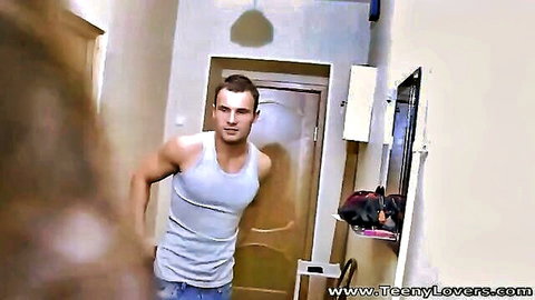 Nessa Shine with muscular guy in tank top, teasing in hallway
