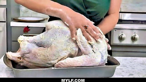 Blond MILF cougar sensually oils turkey in kitchen before blowjob