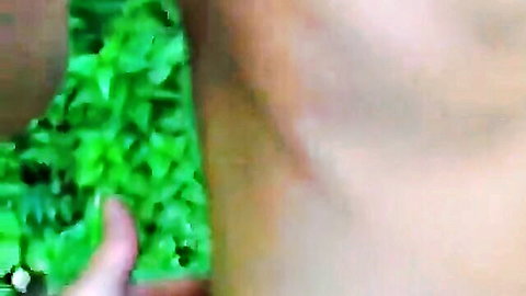 Aleska Diamond in outdoor sex among green foliage, hand on tanned skin