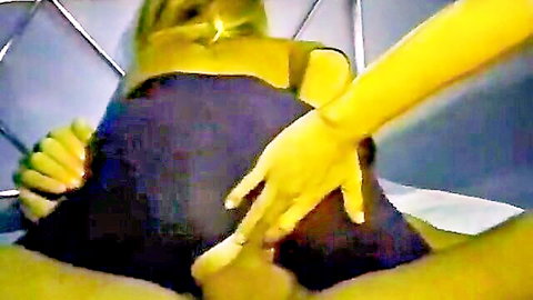 Green-skinned woman in black top with yellow arm in explicit penetration scene