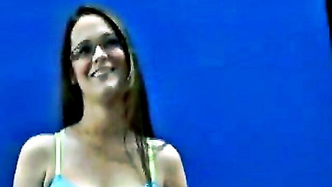 Angelica smiling brunette in green top for calendar try-out