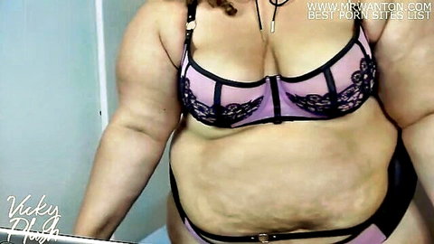 Vicky Plush in purple lace lingerie, curvy BBW posing seductively