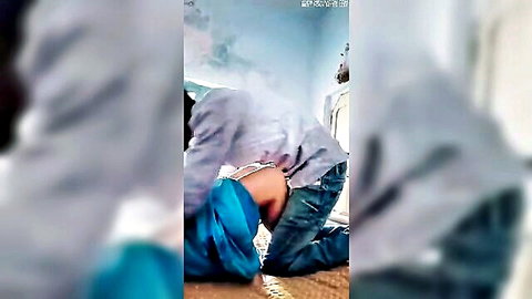 Blurry South Asian man fucking woman's bare ass doggy style pants down on floor