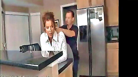 Mature redhead MILF bent over kitchen counter grabbed by man from behind