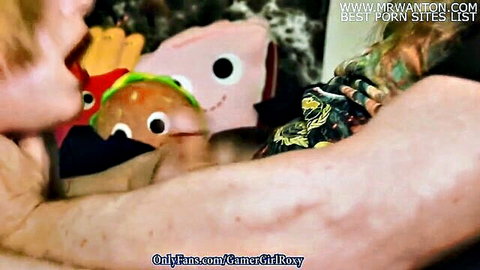 Redhead gamer girl opens mouth wide surrounded by messy McDonald's toys in naughty tease