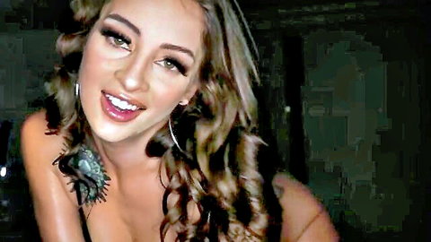 Seductive topless blonde with small perky tits smiling teasingly