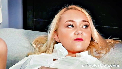 Blonde in open white shirt on couch in lesbian therapy scene
