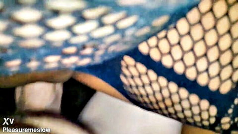 Big ass shaved pussy exposed through blue fishnet stockings closeup with cum drip