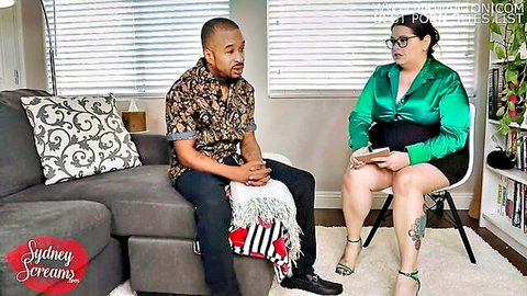 BBW therapist in shiny green blouse and mini skirt consults curvy patient on couch