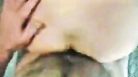 Rough hand squeezes mature MILF's cheeks forcing her drooling mouth open for intense blowjob