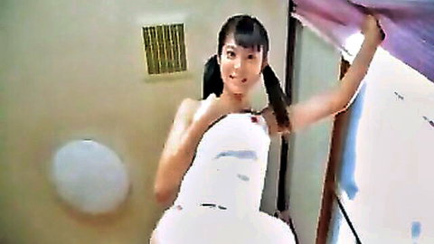Cute Japanese girl with pigtails smiling in white dress, playful pose