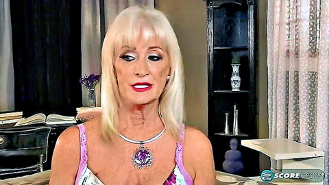 Blonde granny in pink top, mature beauty with heavy makeup