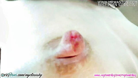 Close-up of big pink erect nipples on pale skin, big nipples fun