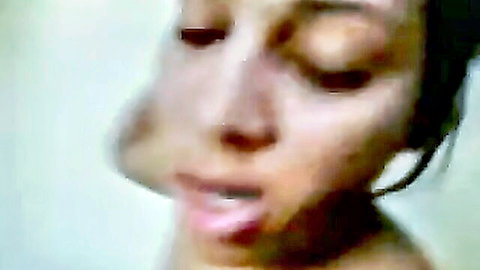 Blurry close-up of sensual Indian Bengali woman's aroused face, mouth open