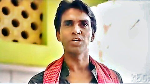 Intense closeup of handsome Indian man in red checkered scarf from sensual South Asian erotic film
