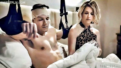 Blonde MILF in leopard dress restrains bandaged muscular son on bed