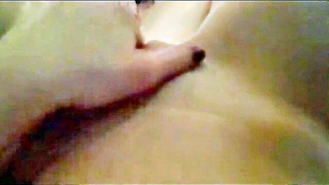 Amateur close-up of nude woman fondling her natural breast
