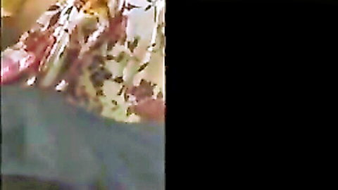 Sexy Indian aunty in pink floral dress posing seductively