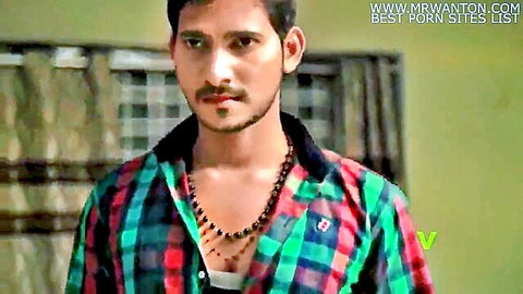 Handsome mustached Indian man in open checkered shirt showing chest seductively