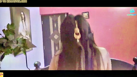 Desi woman with long braided hair in white traditional attire, viewed from behind