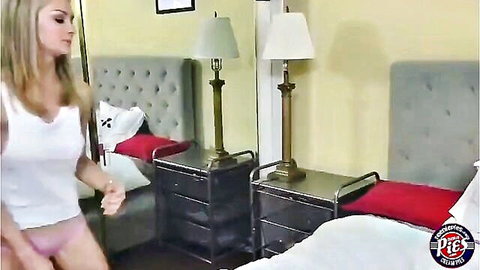 Blonde Allie in white tank top and pink shorts walking into bedroom