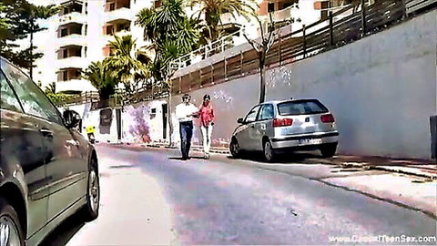 Red Fox strolling outdoors with man in red top and white pants