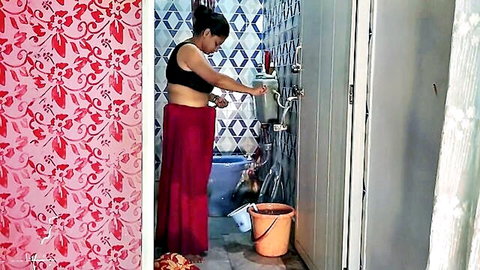 Indian MILF bhabhi bathing in wet black top and red wrap skirt