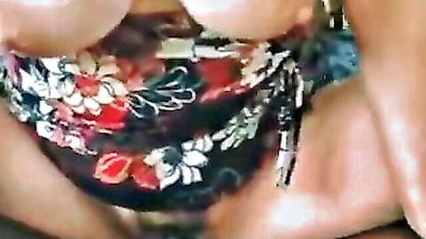 Curvy wife in colorful sarong exposing large breasts during BBC anal fuck