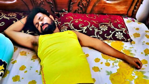 StarSudipa lounging in yellow tank top, bearded Indian star in relaxed pose for POV sex vlog teaser