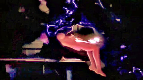 Nude hentai girl suspended in purple-lit ecstasy pose with fantasy effects