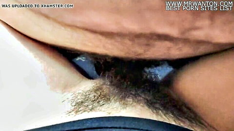 Close-up of hairy pussy with fresh cum dripping from labia