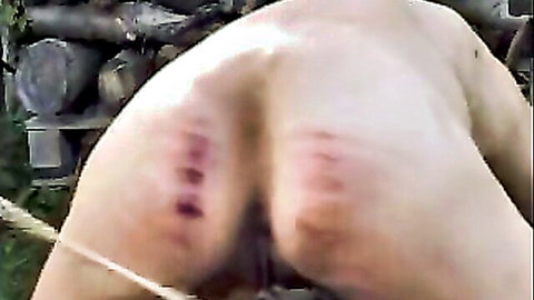 Skinny Angel bent over with cane marks on ass, exposing genitals