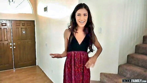 Cameron Canela in sexy black and red dress, smiling tease