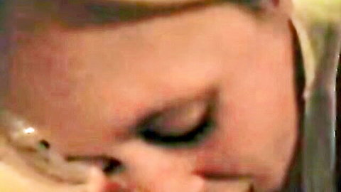 Blonde woman giving intense close-up home blowjob