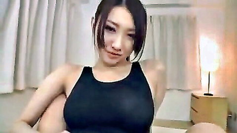 Asian babe in tight black tank top for hose fetish tease