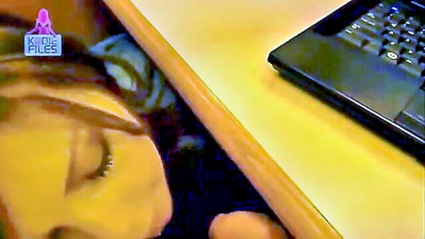 Brunette under desk in cubicle getting facial cumshot