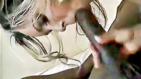 Blonde mature woman giving intense blowjob to massive 30cm black dildo