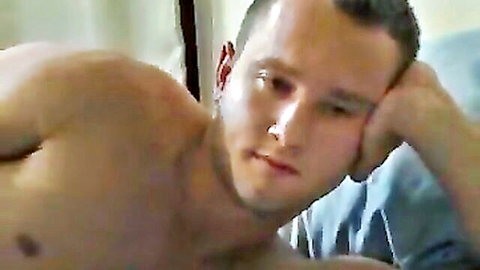 Muscular shirtless daddy lounging thoughtfully on bed in hot adult scene