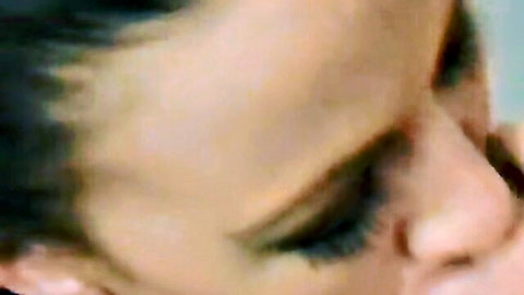 Brunette beauty's seductive side profile close-up with long lashes and parted lips