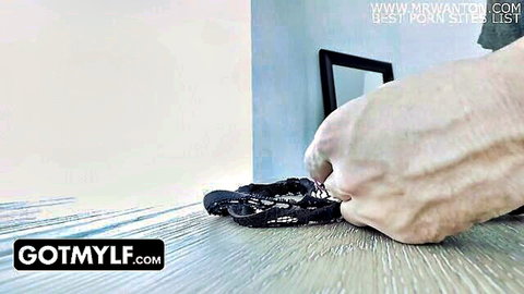 Hand holding black lace panties in blonde MILF vibrating egg shower trick video